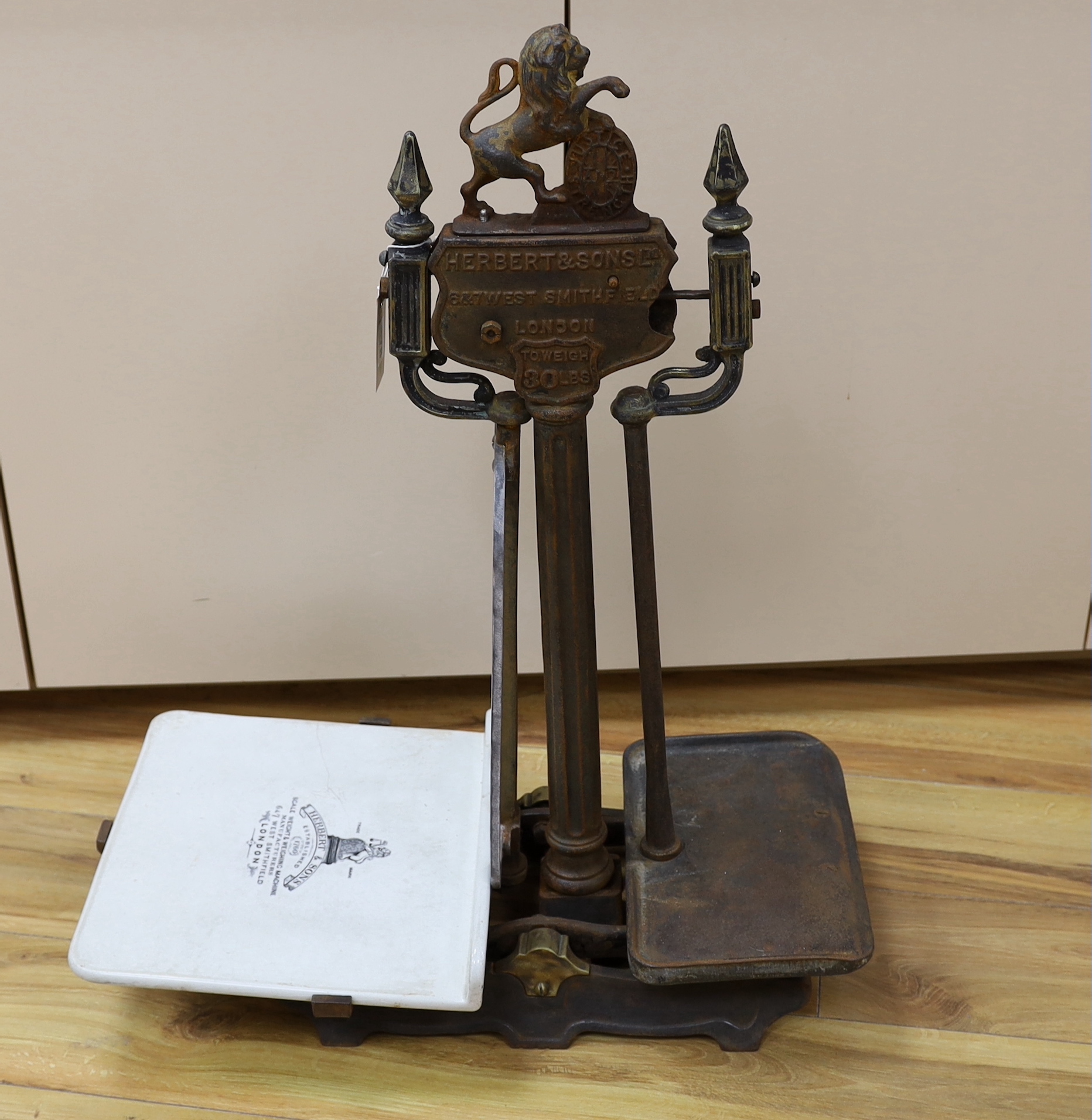 A 19th century Herbert & Sons Ltd. cast iron and porcelain scale set, height 76cm